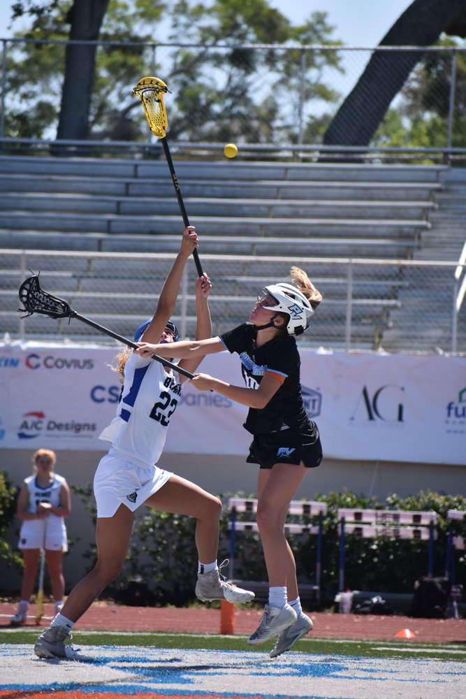 Ponte Vedra’s Lily Darnell leaps to corral a faceoff against Bartram Trail’s Izzy Difato.